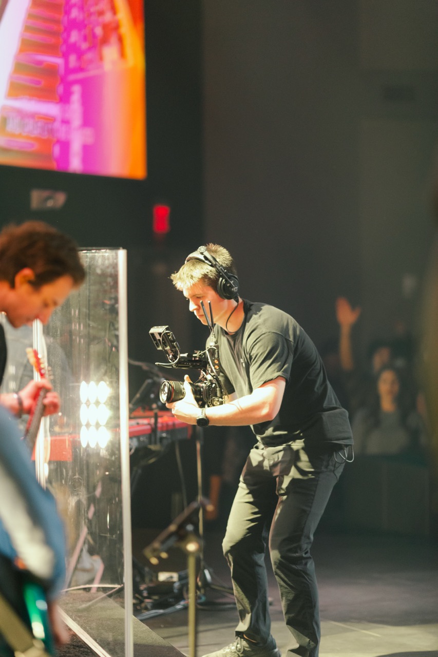 Jake Hill filming a live event